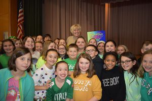 Kindness and Compassion Club students present Mrs. Greene with a plaque