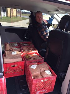 Transportation staff prepares to deliver meals to students in need