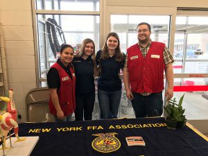 Schuylerville FFA Members Audrey Sickles and Lainey Koval with Greenwich #1575 Tractor Supply Store Manager Wayne Foote and Assistant Manager Kate Buckley during National FFA Week and TSC’s Paper Emblem Days.