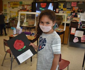 First graders make poppy flowers in honor of veterans