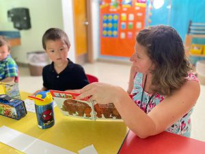 Student works with a teacher during K readiness