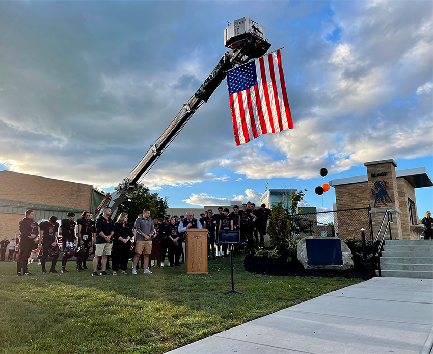 Schuylerville Board of Education President Michael Bodnar speaks during the memorial rock ceremony.