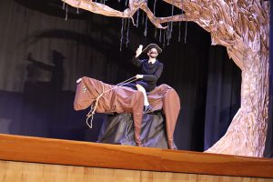 A student performer in The Legend of Sleepy Hollow