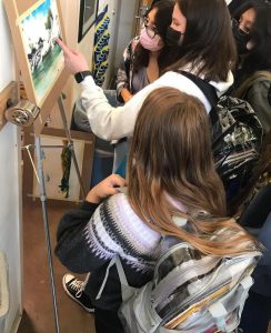 Students observe Kendra Farstad's work.