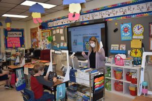 Maria Weeks teaches students about the library catalog