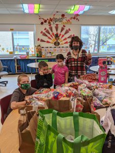 Students sort candy for Treats for Troops