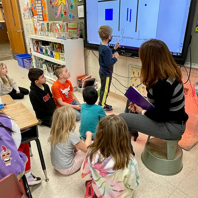 students learning at the smart board