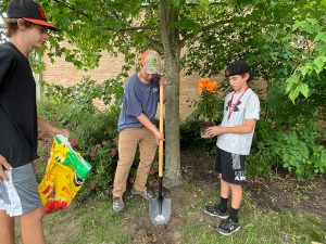 students assist with landscaping