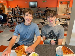 students eat lunch in the cafeteria