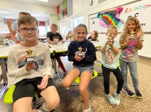students earned a trophy for participating in the reading and math challenge