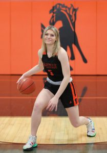 Lauren King playing basketball