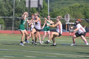 Lauren King playing lacrosse