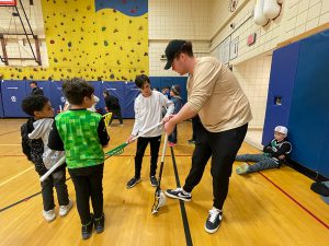 Albany FireWolves player coaches a Schuylerville student.