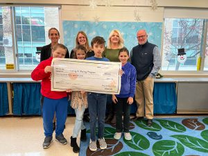 Life Skills students present $250 check to Caring and Sharing program