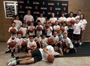 Boys varsity basketball team runs a summer camp for youth