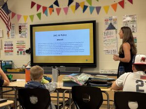 6th grade teacher Jessica Quigley shares the Middle School AI policy with students.