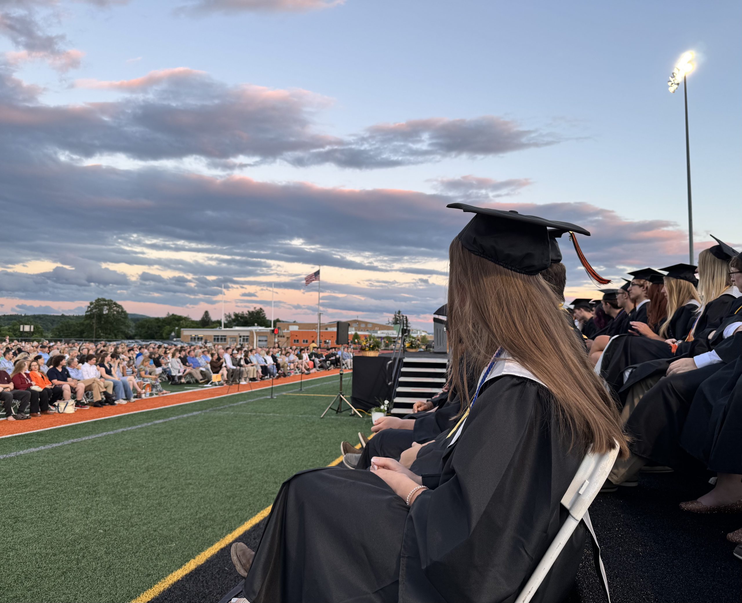 A student takes in the graduation ceremony