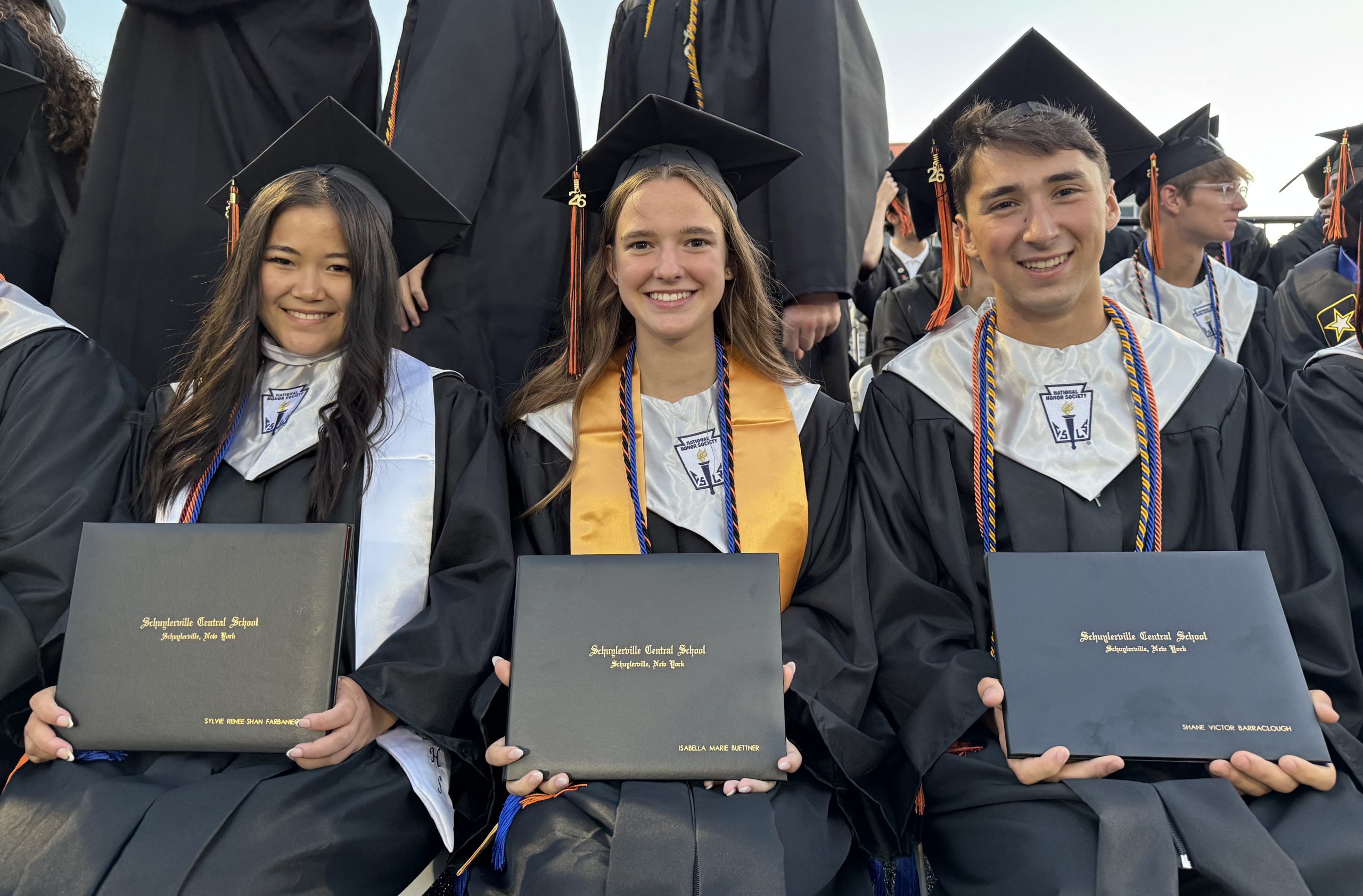 Students with their diplomas 