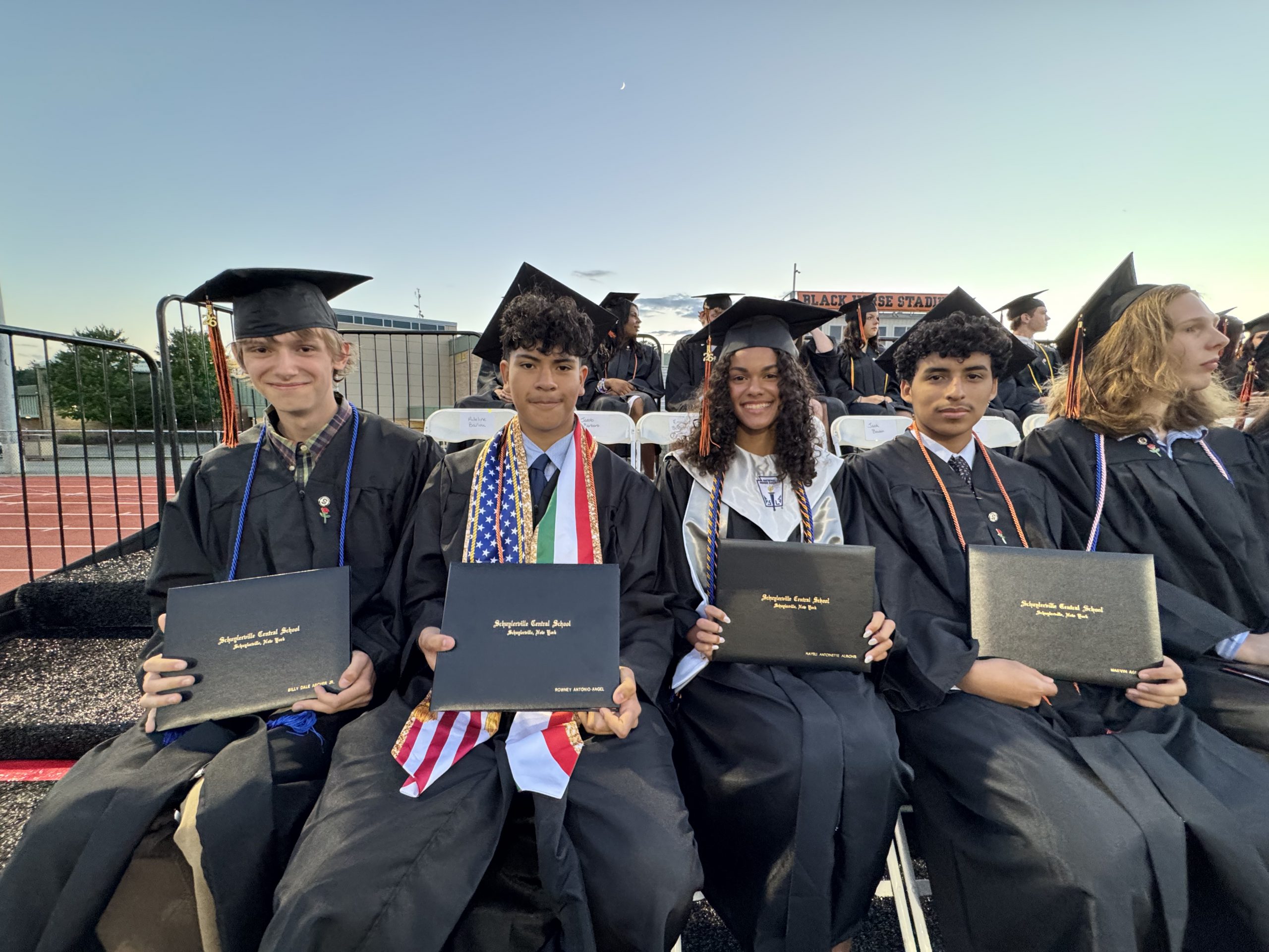 Students with their diplomas 