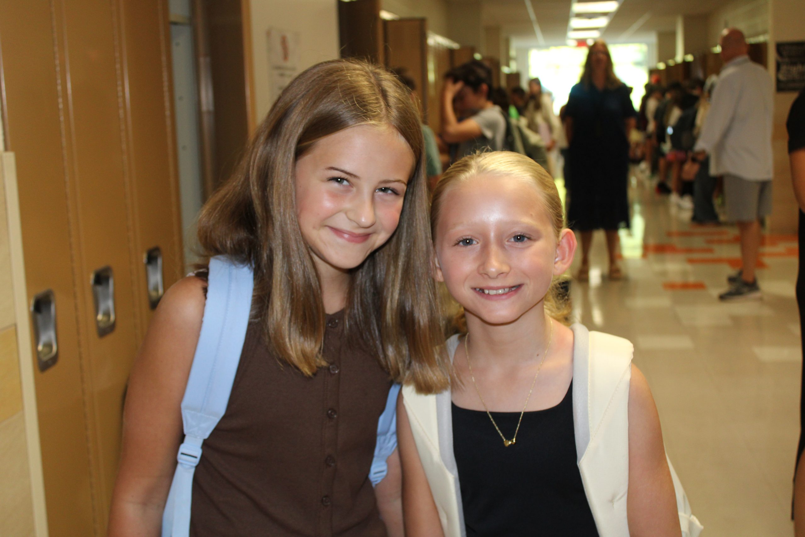 Two middle school students head to class